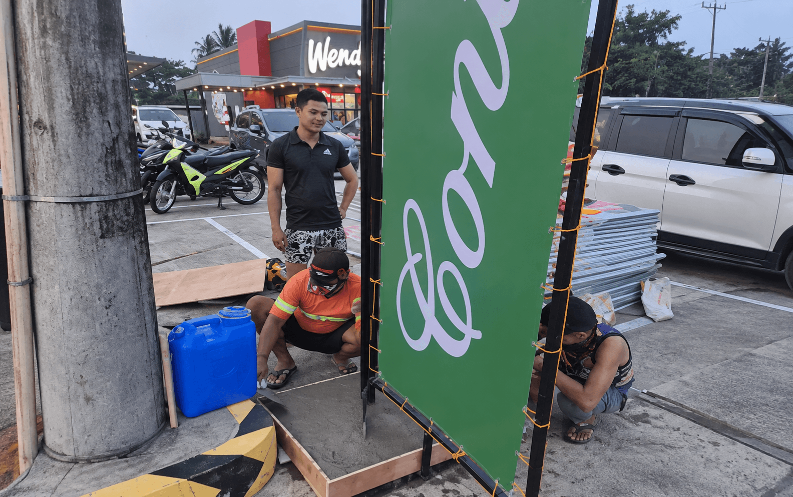 Contis Metal Ad Installation